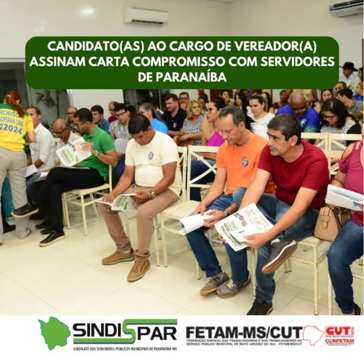 Imagem de candidatos a Vereador de Paranaíba assinando carta compromisso com servidores municipais.